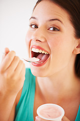 Image showing Eating, yogurt and portrait of woman with healthy food, diet or nutrition in studio with happiness. Happy, face and girl with spoon, yoghurt and strawberry flavor of dairy, product or snack for lunch