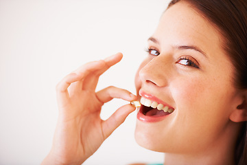 Image showing Healthy, woman and portrait with supplement, pill and tablet for nutrition, diet and vitamin c benefits. Happy, face and girl eating pharmaceutical capsule with omega 3, iron and healthcare medicine