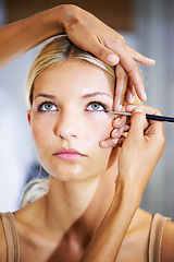 Image showing Makeup, stylist and brush on face of woman for cosmetics, beauty or application of eyeshadow color. Eyes, powder and hands on model with cosmetic, mascara and skincare for celebrity or actor in salon