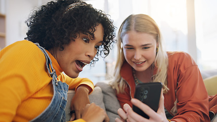 Image showing Friends, phone and talking on a home sofa with internet connection, social media and online chat. Women laughing together on a couch with a smartphone for communication, surprise or wow gossip