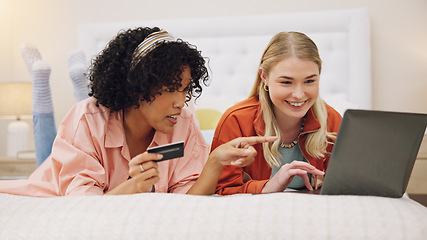 Image showing Credit card, women and friends with laptop on a bed for ecommerce, sale or sign up subscribe in their home. Online shopping, payment and lady customer online in a bedroom for deal, budget or survey