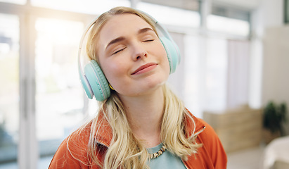 Image showing Music, smile and relax with woman on sofa for streaming, happy and energy. Freedom, media and online radio with person listening to headphones in living room at home for technology, sound and audio