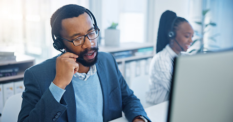 Image showing Computer, customer support and a black man consultant working in a call center for service or assistance. Contact, crm and headset communication with an employee consulting in a retail sales office