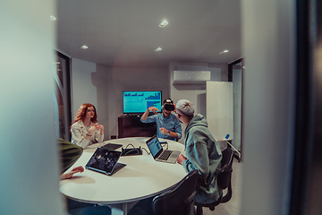 Image showing A diverse group of businessmen collaborates and tests a new virtual reality technology, wearing virtual glasses, showcasing innovation and creativity in their futuristic workspace