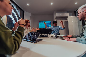 Image showing A diverse group of businessmen collaborates and tests a new virtual reality technology, wearing virtual glasses, showcasing innovation and creativity in their futuristic workspace