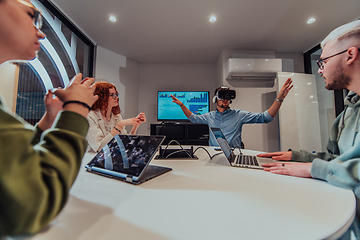 Image showing A diverse group of businessmen collaborates and tests a new virtual reality technology, wearing virtual glasses, showcasing innovation and creativity in their futuristic workspace