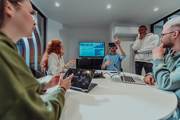 Image showing A diverse group of businessmen collaborates and tests a new virtual reality technology, wearing virtual glasses, showcasing innovation and creativity in their futuristic workspace