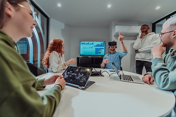 Image showing A diverse group of businessmen collaborates and tests a new virtual reality technology, wearing virtual glasses, showcasing innovation and creativity in their futuristic workspace