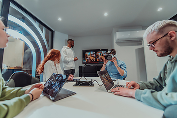 Image showing A diverse group of businessmen collaborates and tests a new virtual reality technology, wearing virtual glasses, showcasing innovation and creativity in their futuristic workspace