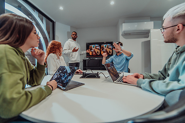 Image showing A diverse group of businessmen collaborates and tests a new virtual reality technology, wearing virtual glasses, showcasing innovation and creativity in their futuristic workspace