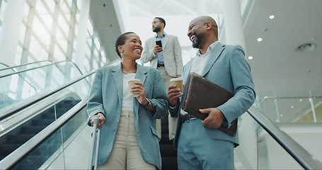 Image showing Happy business people, coffee and laughing on escalator for funny joke, discussion or morning at airport. Businessman and woman smile with latte or cappuccino down a moving staircase for work travel