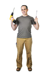 Image showing Handyman with a drill and screwdriver