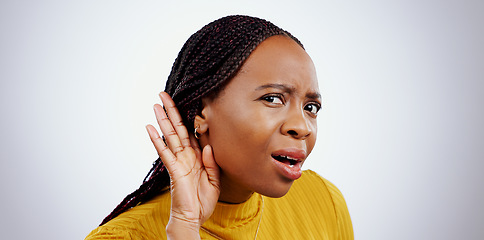 Image showing Portrait of black woman, hand and ear in studio for gossip, story or frustrated face by grey background. African girl, hearing or confused by secret information, news and communication with questions