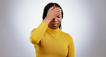 Image showing Headache, black woman and pain with stress, anxiety and problem from vertigo in studio. White background, African female person and mental health with fatigue and sick from migraine, fail or grief