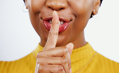 Image showing Secret, woman and hands with finger on lips in studio for privacy, confidential deal and surprise on white background. Closeup, mouth and face of model with quiet emoji for gossip, news and whisper