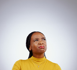 Image showing Woman, thinking and doubt for confused, decision and problem solving with idea by grey background. Student, african and trendy youth in brainstorming or university choice, education and studio mockup