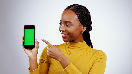 Image showing Woman, phone and green screen for presentation mockup, marketing and happy news on a white background. Young african person on mobile app, space and opportunity with tracking marker in studio