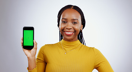 Image showing Happy woman, phone and green screen of marketing mockup, online presentation or news on white background. Portrait of african person on mobile app, website design space and tracking markers in studio