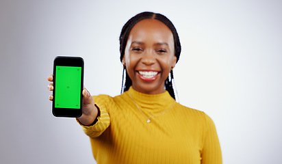Image showing Woman, student and phone green screen for marketing mockup, e learning sign up or news on white background. Portrait of african person on mobile app space, college contact or education FAQ in studio