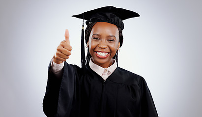 Image showing Graduation cap, thumbs up and woman or student success with celebration, education and learning or college achievement in studio. Portrait of an african graduate with like emoji on a white background