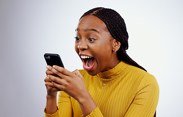 Image showing Woman, reading phone and wow for happy news, social media competition or giveaway success on a white background. African person with surprise, excited and shocked for mobile sale or bonus in studio