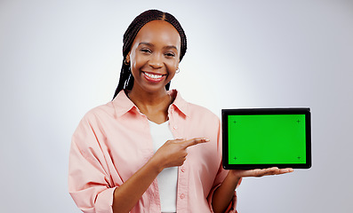 Image showing Woman, presentation and tablet green screen for e learning, online education or promotion on white background. Portrait, African student and digital technology, study opportunity or website in studio