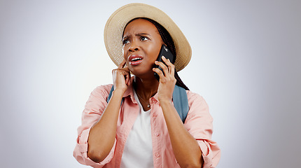 Image showing Phone call, travel and black woman with stress, surprise and shocked on a grey studio background. African person, tourism and model with a smartphone, listening and news with reaction and frustrated