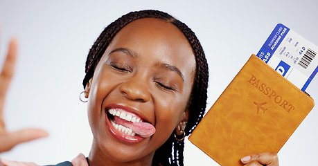 Image showing Selfie, face or happy black woman with a passport in studio for holiday travel or post vacation trip online. Grey background, social media or African tourist with ticket or tongue out in celebration