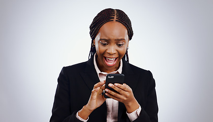 Image showing Business woman, reading phone and wow for news, email or notification of investment or bonus on a white background. African person in surprise, excited and shocked on mobile for opportunity in studio