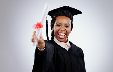 Image showing Graduate, woman and student diploma for education, college or university success on a white background. Excited portrait of person with graduation award, certificate or learning achievement in studio