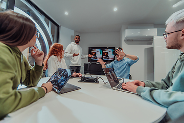 Image showing A diverse group of businessmen collaborates and tests a new virtual reality technology, wearing virtual glasses, showcasing innovation and creativity in their futuristic workspace