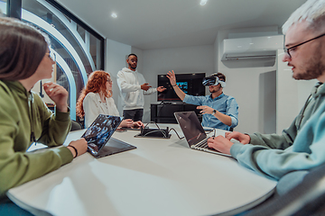 Image showing A diverse group of businessmen collaborates and tests a new virtual reality technology, wearing virtual glasses, showcasing innovation and creativity in their futuristic workspace