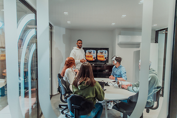 Image showing A diverse group of businessmen collaborates and tests a new virtual reality technology, wearing virtual glasses, showcasing innovation and creativity in their futuristic workspace