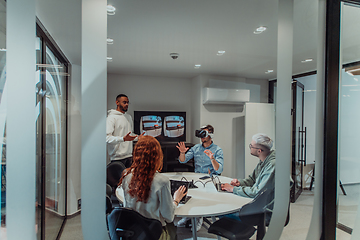 Image showing A diverse group of businessmen collaborates and tests a new virtual reality technology, wearing virtual glasses, showcasing innovation and creativity in their futuristic workspace