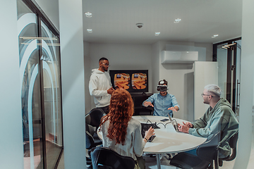 Image showing A diverse group of businessmen collaborates and tests a new virtual reality technology, wearing virtual glasses, showcasing innovation and creativity in their futuristic workspace