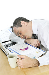 Image showing Businessman asleep at his desk on white background