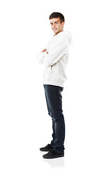 Image showing Portrait, man and smile with arms crossed in studio with casual fashion, jacket and jeans for style on white background. Happy young guy with confidence, good mood and positive attitude from Russia