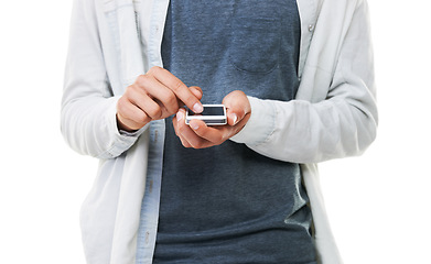 Image showing Hands, man and typing with phone in studio, scroll social media and reading notification on white background. Closeup, model and download app for mobile games, search online and digital subscription