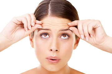 Image showing Skincare, stress and woman with forehead wrinkles check in studio for inspection on white background. Beauty, fail or female model with aging, anxiety or allergic reaction to cosmetics or treatment