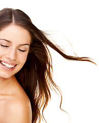 Image showing Hair care, woman and beauty with smile in studio with cosmetics, collagen and healthy texture. Person, face or eyes closed for shampoo glow, shine or results on white background with beauty treatment