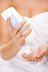 Image showing Woman, skincare and hands with cream, sunscreen and lotion for dermatology and self care in bathroom. Shower, product and person with bottle of moisturiser for body, beauty and healthy skin routine