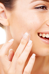 Image showing Happy woman, face and hands with cream for skincare, beauty or cosmetics against a studio background. Closeup of female person or model smile in satisfaction for lotion, creme or facial product