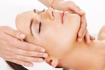 Image showing Head, hands and massage with a woman customer in studio isolated on a white background for stress relief. Spa, luxury face treatment and a young person at the salon for health, wellness or to relax