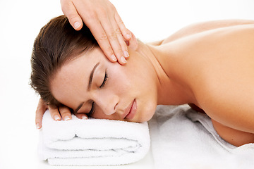 Image showing Hand, face and spa massage with a woman in studio isolated on white background to relax. Head, wellness or luxury treatment and a young customer at the salon for physical therapy with a masseuse