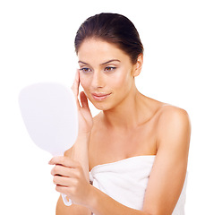 Image showing Happy woman, mirror and skincare for makeup, beauty or product isolated against a white studio background. Female person or model applying lotion, cream or treatment for facial cosmetics on face