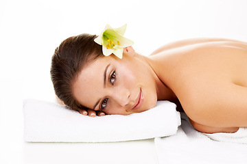 Image showing Happy woman, portrait and relax with flower in spa, zen or massage isolated on a white studio background. Face of female person or model smile in skincare for health body therapy, salon or treatment