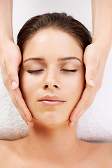 Image showing Spa, massage and hands on face of woman from above at a resort for stress relief, pamper or treatment. Top view, facial and female with masseuse at a beauty salon for luxury, skincare or dermatology