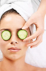 Image showing Woman, hand and cucumber on eyes for wellness, cosmetic or spa therapy with closeup, relax and peace. Person, skincare or detox treatment for beauty, skin or stress relief and relaxation or wellbeing