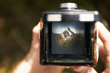 Image showing Camera, viewfinder and woman with photography, outdoor and pose with nature, memory and picture. Photo, closeup and person with summer break, photographer and field with digital equipment and frame