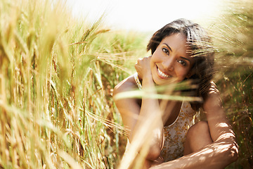 Image showing Portrait, smile and woman in wheat field in the countryside in summer outdoor, beauty and health. Face, happy person at farm and nature, garden and travel on holiday, vacation and relax in Brazil
